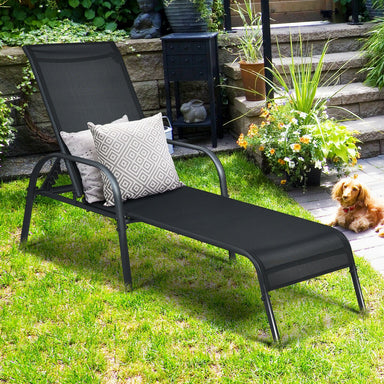 5-Position Adjustable Black Patio Chaise Lounge Chair with Breathable Fabric & Steel Frame in a garden setting, featuring decorative pillows and surrounded by plants.