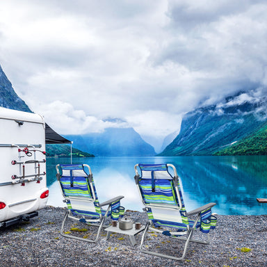 Dream Yard Oasis 2-Pack 5-Position Folding Beach Chairs with Table situated by a lake, showcasing the stylish blue and green design, ideal for camping and outdoor adventures.