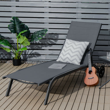 6-Position Adjustable Outdoor Chaise Lounge Chair with Wheels by Dream Yard Oasis, featuring a sleek gray design, plush cushion, and a vibrant plant backdrop on a wooden deck.