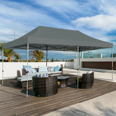 10x20 Feet Adjustable Heavy Duty Folding Canopy Shelter with Carry Bag - Gray, Water Resistant set up on a patio with stylish outdoor furniture.