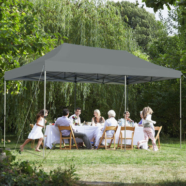 10x20 Feet Adjustable Heavy Duty Folding Canopy Shelter with Carry Bag - Gray, Water Resistant providing shade for a family gathering on a lawn.
