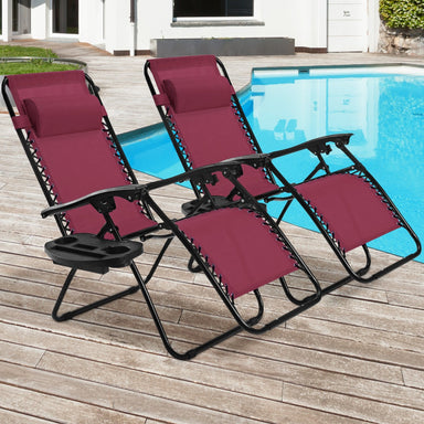 Two 2-Piece Wine Zero Gravity Folding Lounge Chairs with Cup Holders by Dream Yard Oasis ™, set by a beautiful poolside, showcasing their compact design and stylish color.