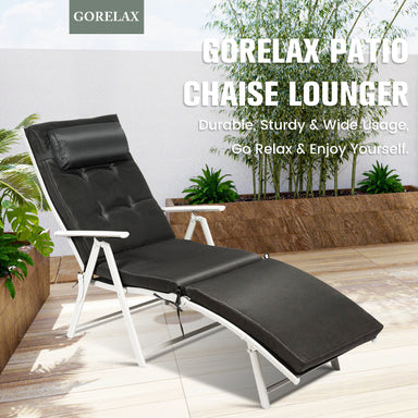 Adjustable 7-Position Outdoor Folding Chaise Lounge Chair with Pillow & Cushion - Black, featuring a sleek design in a patio setting, perfect for relaxation.