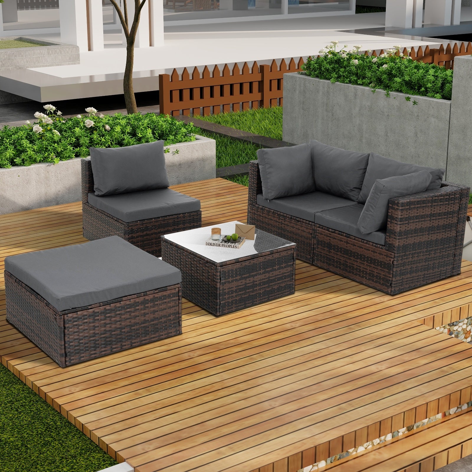 Dream Yard Oasis™ 5-Piece Brown PE Wicker Patio Furniture Set for 4, showcasing the arrangement of a sofa, two chairs, and a coffee table in a sunny backyard.