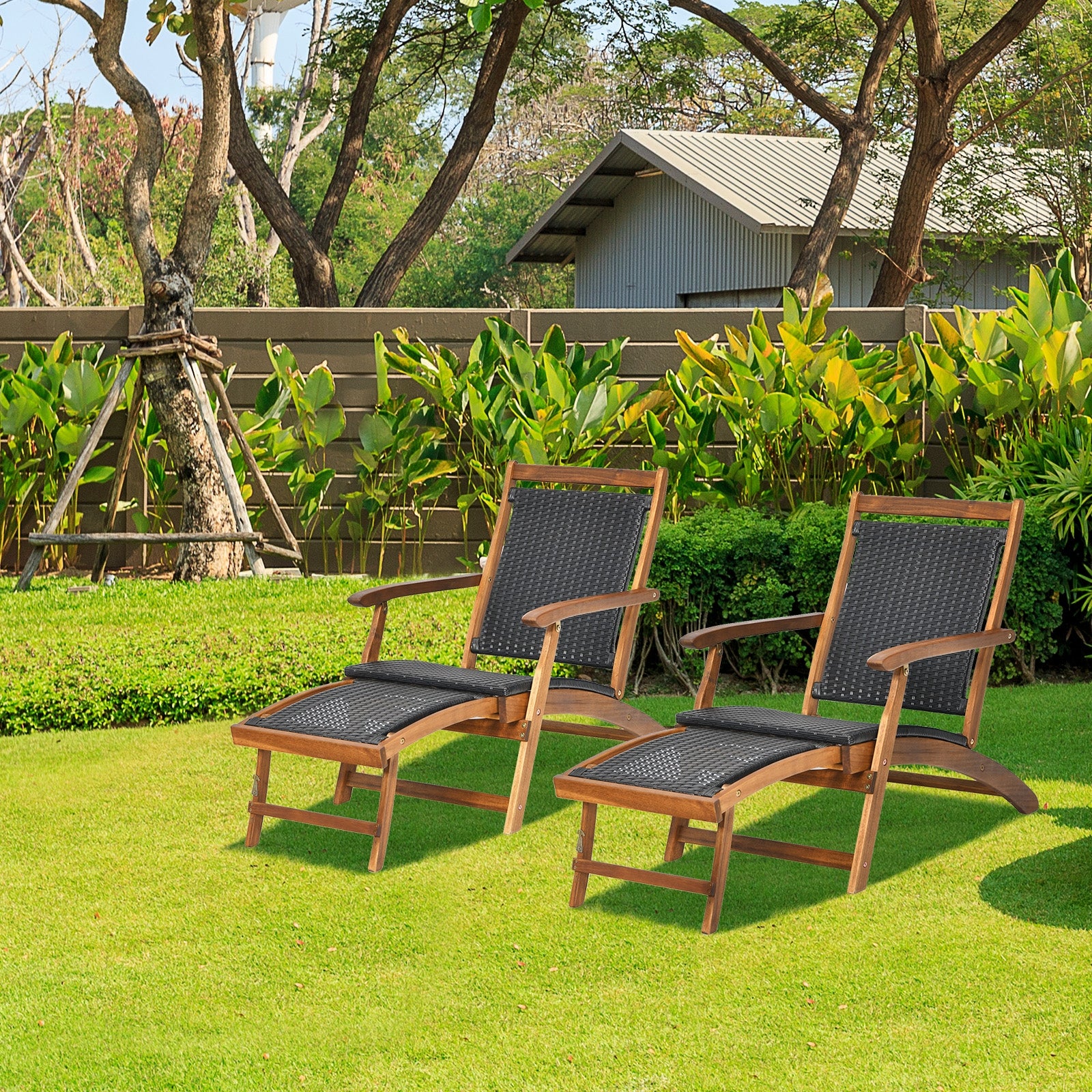 Two Patio Rattan Folding Lounge Chairs with Acacia Wood Frame and Retractable Footrest by Dream Yard Oasis, placed in a green garden setting, showcasing comfort and stylish design.