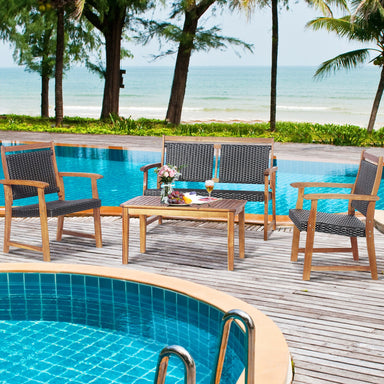 4-Piece Acacia Wood Frame Outdoor Rattan Sofa Set by Dream Yard Oasis ™ positioned by a serene poolside, featuring two single sofas, a loveseat, and a coffee table, perfect for relaxing outdoors.