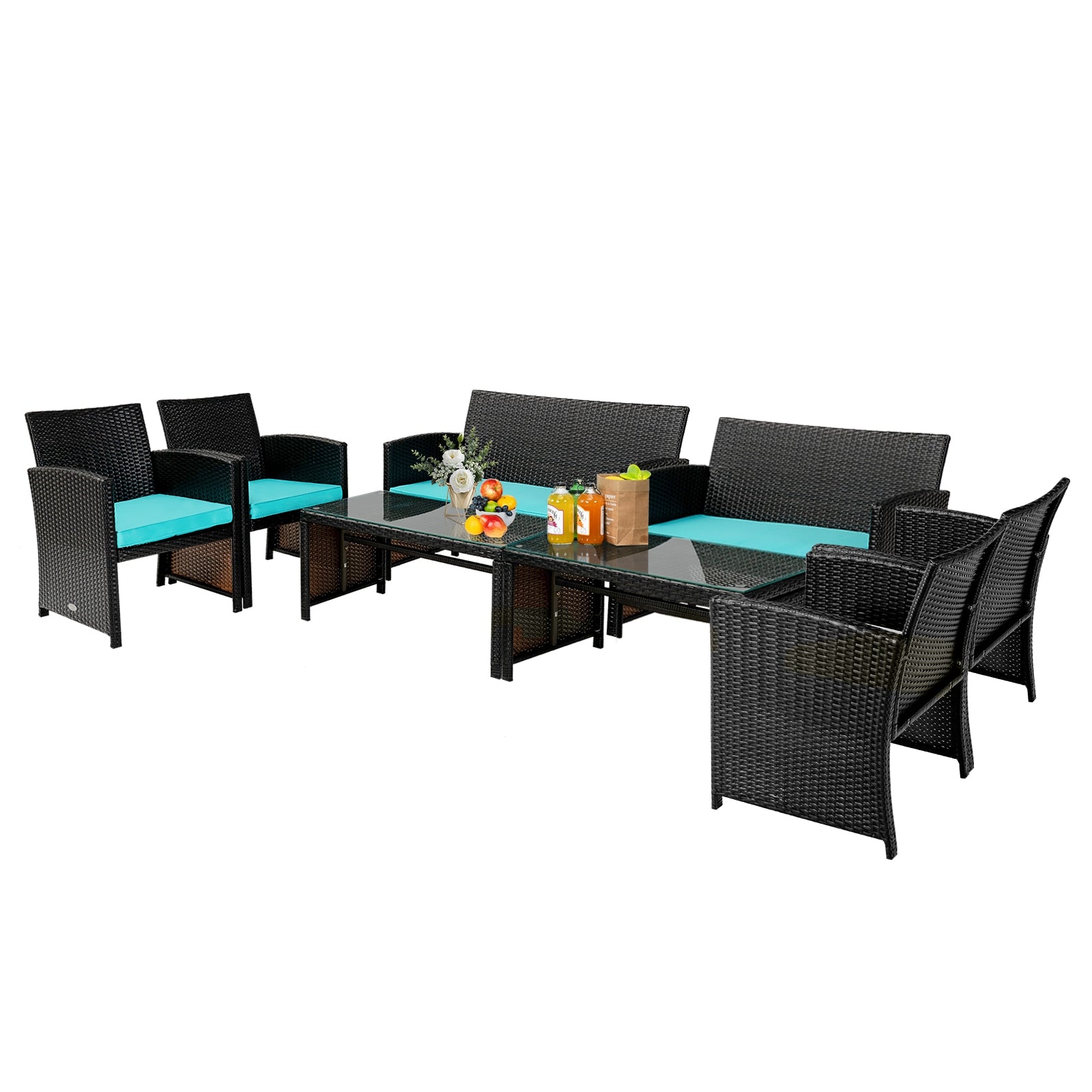 Extended view of the 4-Piece Cushioned Patio Rattan Furniture Set in Green, showing additional seating and refreshing beverages on the coffee table.