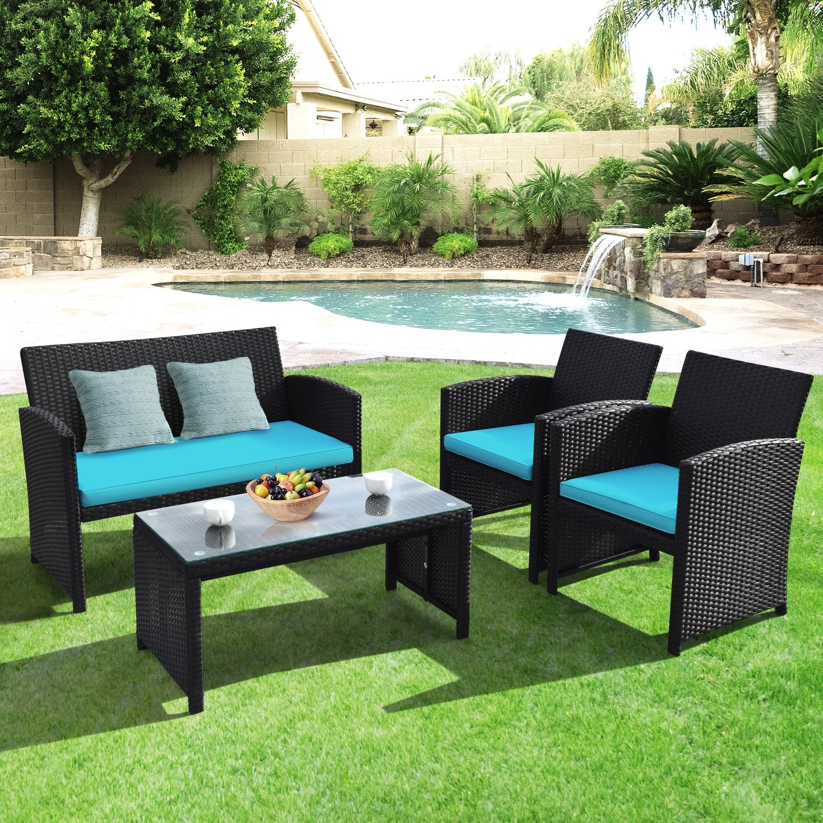 Stylish 4-piece rattan patio furniture set by Dream Yard Oasis, featuring turquoise cushions, placed on a lush green lawn with a pool in the background.