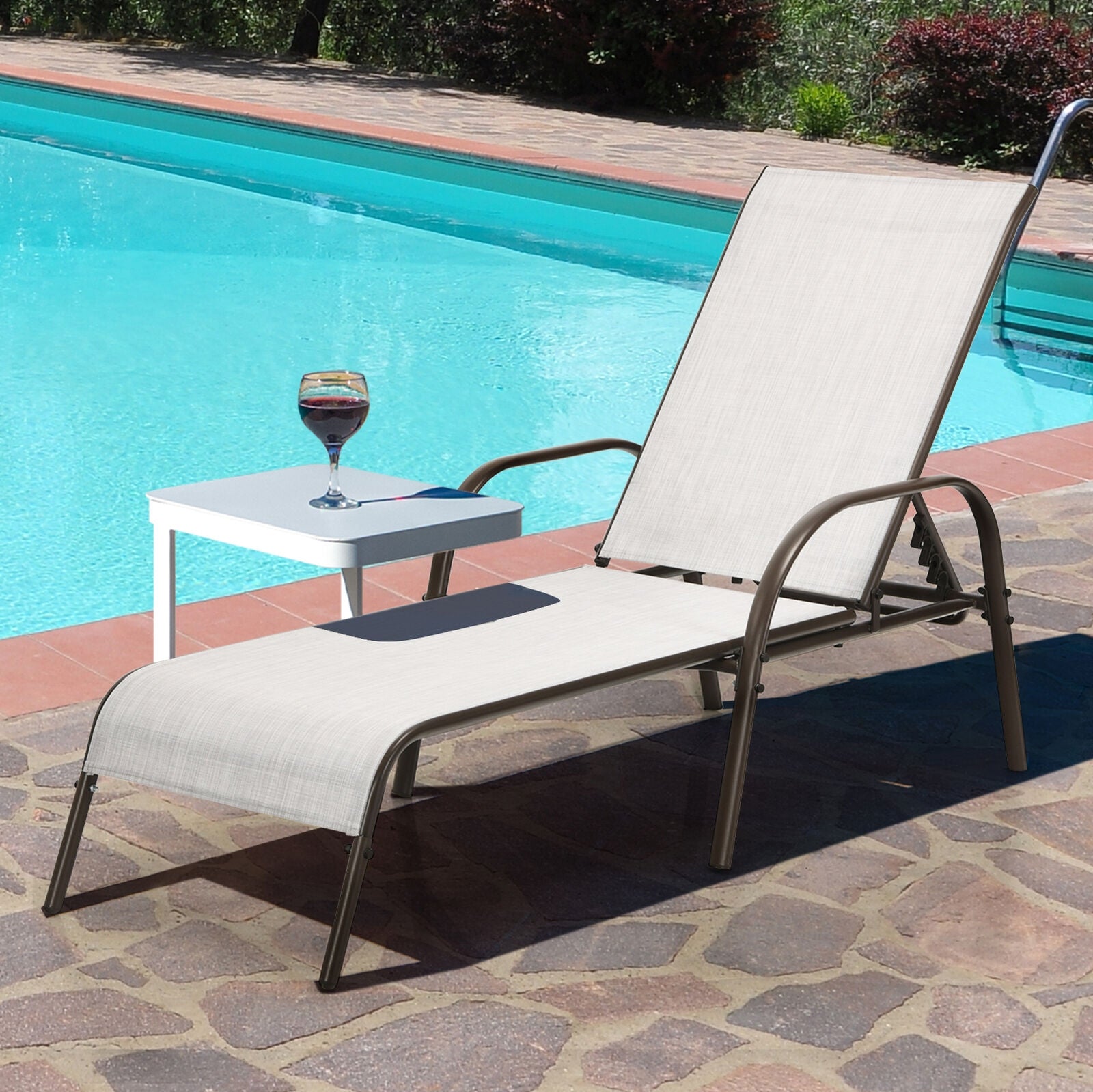 2-Piece Gray Outdoor Patio Lounge Chairs with Adjustable Reclining Armrests for Ultimate Comfort next to a swimming pool, highlighting their durable and weather-resistant material.