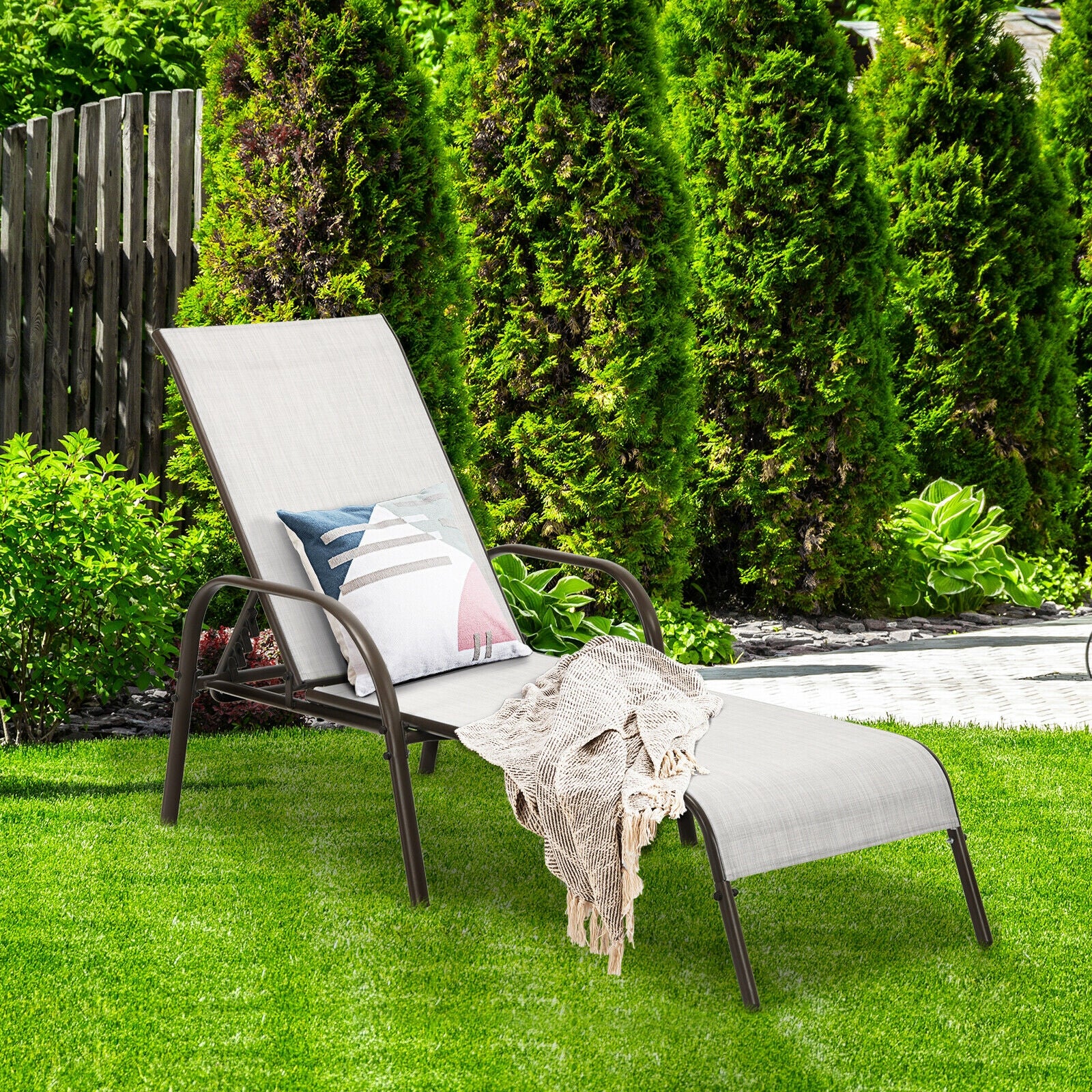 2-Piece Gray Outdoor Patio Lounge Chairs with Adjustable Reclining Armrests for Ultimate Comfort in a garden setting, featuring a cozy blanket and decorative pillow.