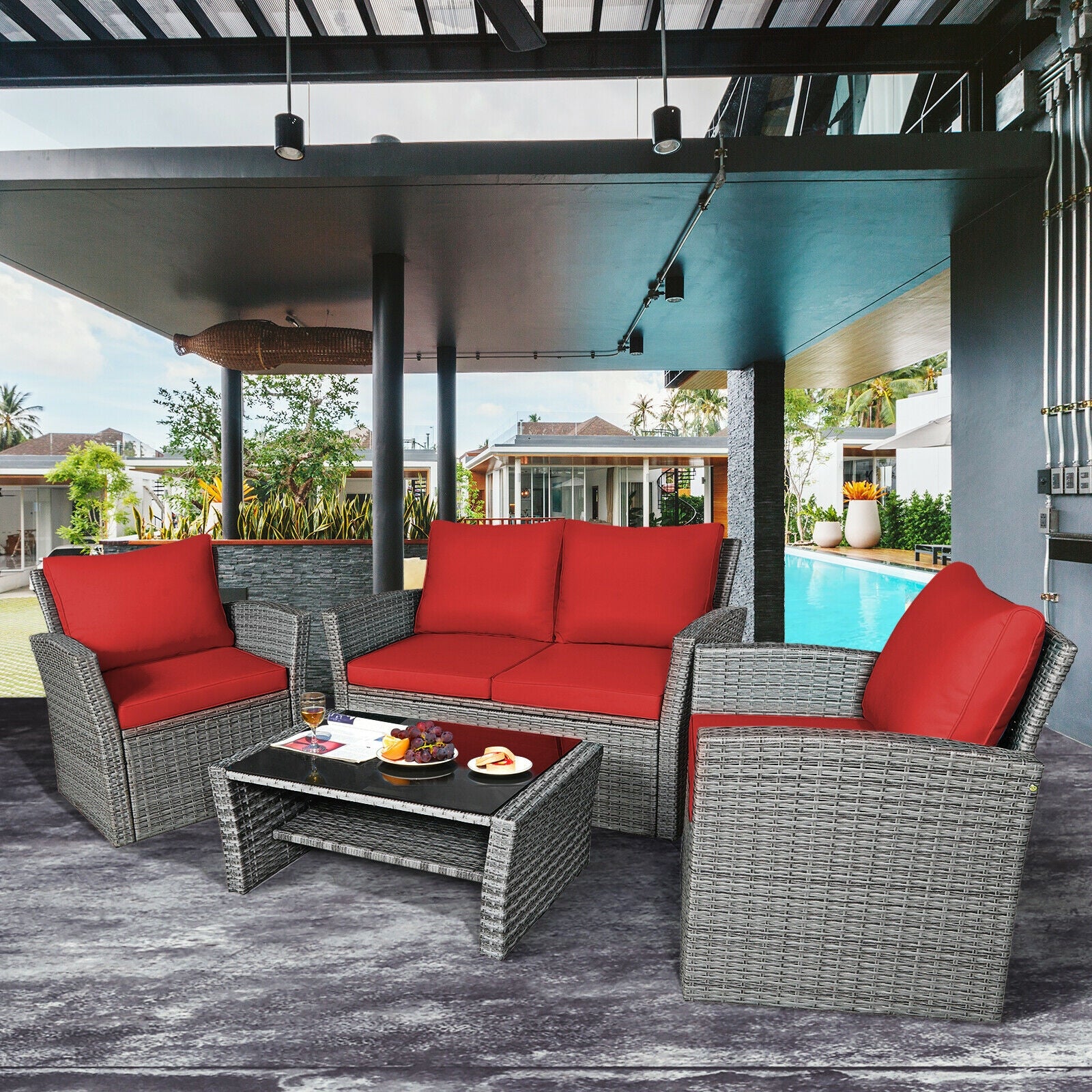 4-Piece Patio Rattan Furniture Set with Cushions, Table & Storage Shelf - Red arranged in a modern outdoor setting by a pool, perfect for relaxing and entertaining.
