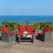 4-Piece Patio Rattan Furniture Set by Dream Yard Oasis featuring cozy red cushions, perfect for outdoor gatherings with a stunning ocean view in the background.