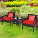 3 Piece PE Rattan Wicker Sofa Set featuring two comfy chairs with red cushions and a stylish coffee table, set in a vibrant outdoor garden.
