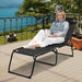 Adjustable Folding Beach Lounge Chair with Pillow, designed for relaxation on a patio with stunning views, perfect for reading or sunbathing.