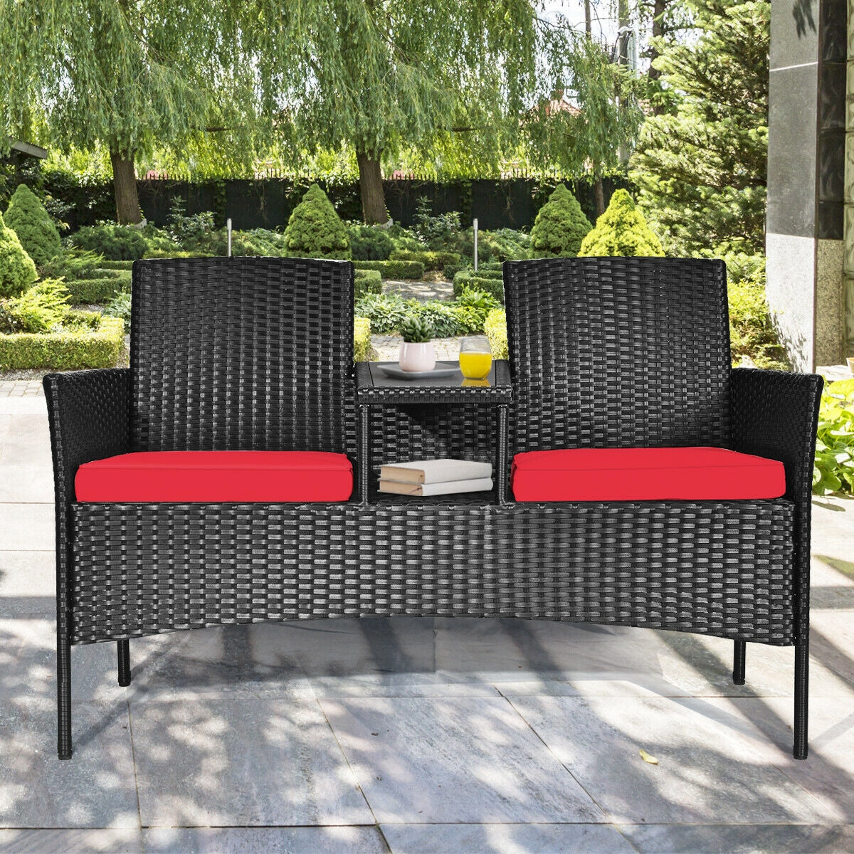 Cozy 2-Piece Wicker Patio Conversation Set with Removable Cushions & Glass Table - Red, featuring a stylish design in a beautiful garden setting.