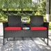 Cozy 2-Piece Wicker Patio Conversation Set with Removable Cushions & Glass Table - Red, featuring a stylish design in a beautiful garden setting.