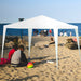 10'x10' Outdoor Canopy Tent with 4 Removable Sidewalls set up on a beach, providing shade for guests.