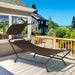 Patio Hanging Chaise Lounge Chair with Canopy, Cushion, Pillow & Side Storage - Brown by Dream Yard Oasis ™ placed on a patio, illustrating its stylish design and relaxation capabilities.