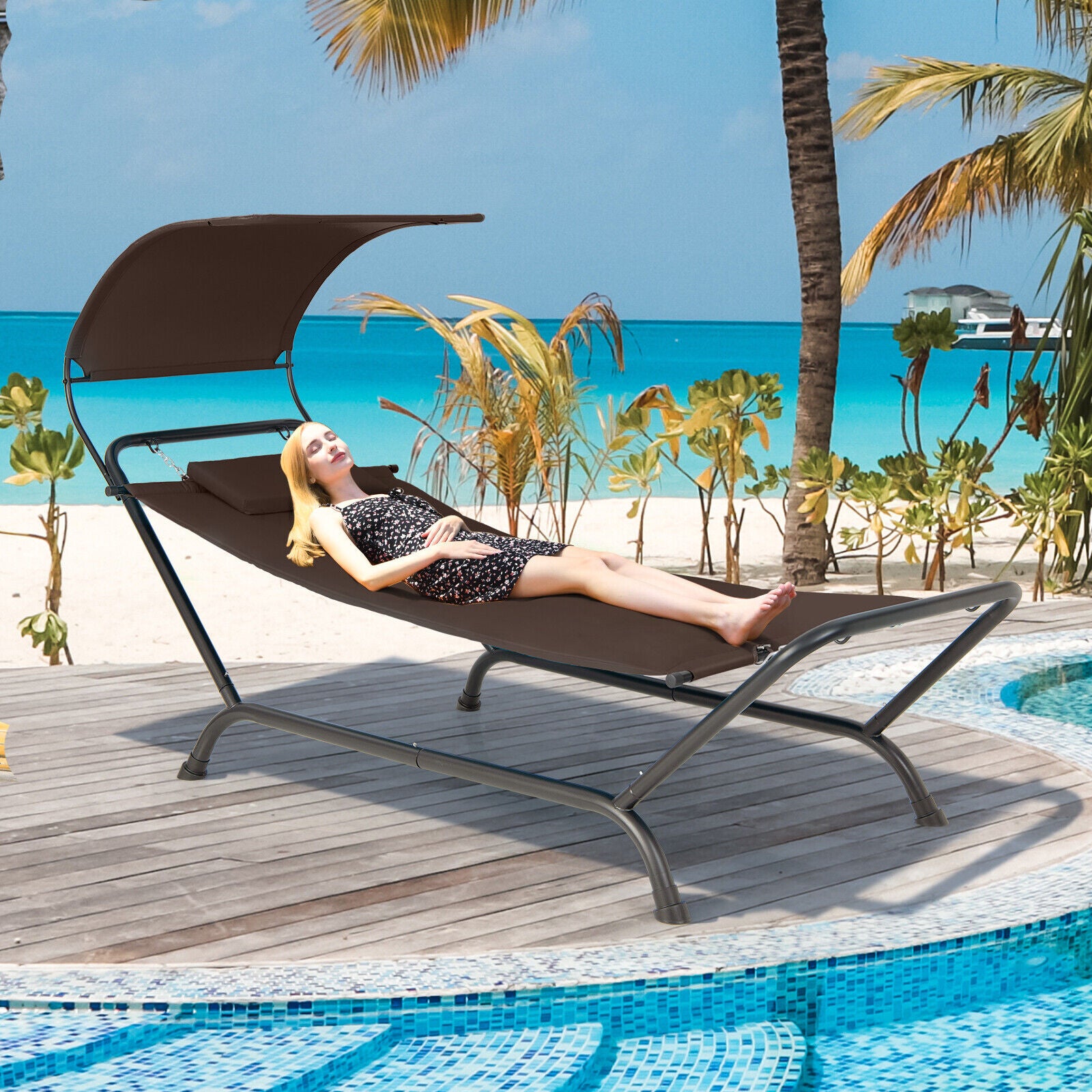 Patio Hanging Chaise Lounge Chair with Canopy, Cushion, Pillow & Side Storage - Brown by Dream Yard Oasis ™ shown at the beach, highlighting its comfort and outdoor appeal.