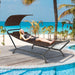 Patio Hanging Chaise Lounge Chair with Canopy, Cushion, Pillow & Side Storage - Brown by Dream Yard Oasis ™ shown at the beach, highlighting its comfort and outdoor appeal.