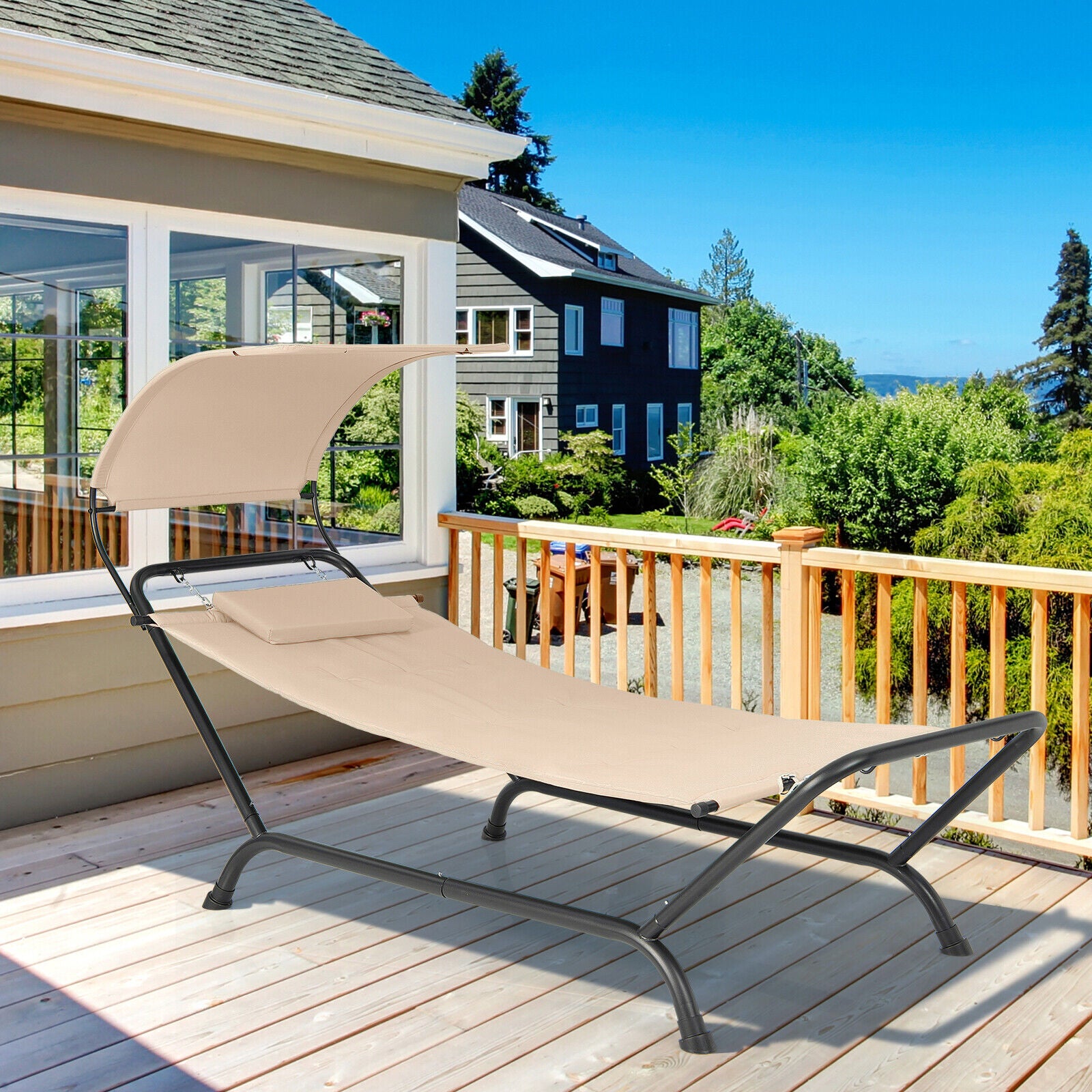 Beige Patio Hanging Chaise Lounge Chair with Canopy, Cushion, and Storage Bag - Comfortable Outdoor Relaxation showcased on a deck with a scenic view.