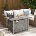 The 43-Inch Gray Propane Fire Pit Table in a stylish outdoor setting with drinks and snacks, showcasing its dual function as a fire pit and coffee table.