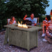 Outdoor gathering around the 43-Inch Gray Propane Fire Pit Table, featuring flames, friends enjoying music, and a cozy atmosphere with a 50,000 BTU heat output.