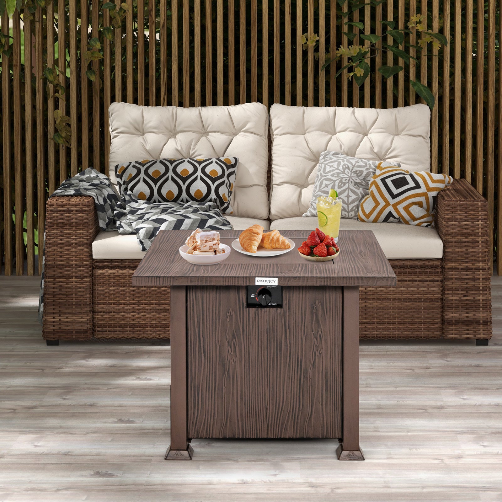 32 Inch Square Fire Pit Table with 50,000 BTU Burner being used as a coffee table with snacks and drinks, complementing outdoor seating.