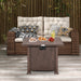 32 Inch Square Fire Pit Table with 50,000 BTU Burner being used as a coffee table with snacks and drinks, complementing outdoor seating.