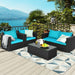 4-Piece Turquoise Patio Rattan Sofa Set with Cushions & Tempered Glass Table showcased on a beautiful balcony overlooking a scenic view.