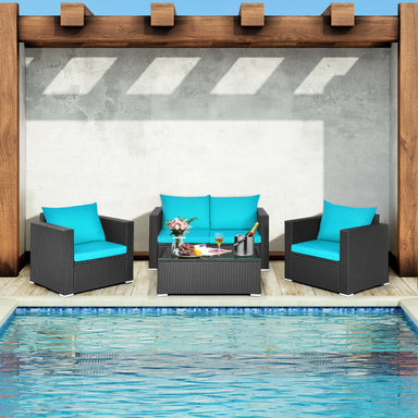 4-Piece Turquoise Patio Rattan Sofa Set with Cushions & Tempered Glass Table placed beside a stylish pool area, perfect for outdoor gatherings.