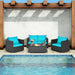 4-Piece Turquoise Patio Rattan Sofa Set with Cushions & Tempered Glass Table placed beside a stylish pool area, perfect for outdoor gatherings.