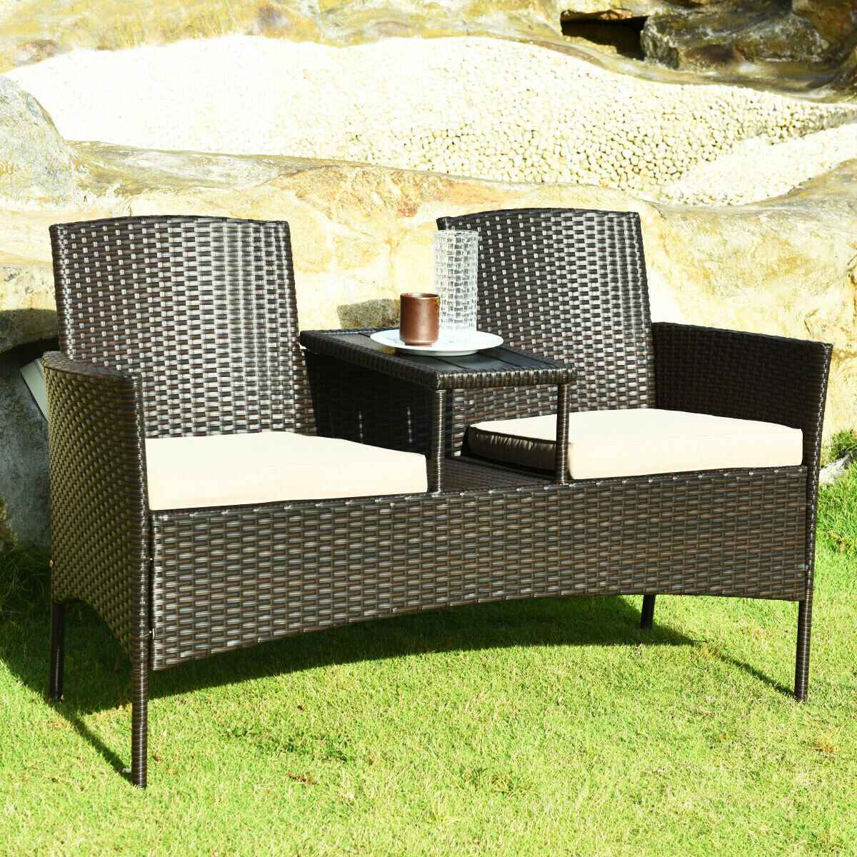 Modern patio conversation set with coffee table featuring cozy beige cushions, rugged PE rattan design, perfect for outdoor leisure.
