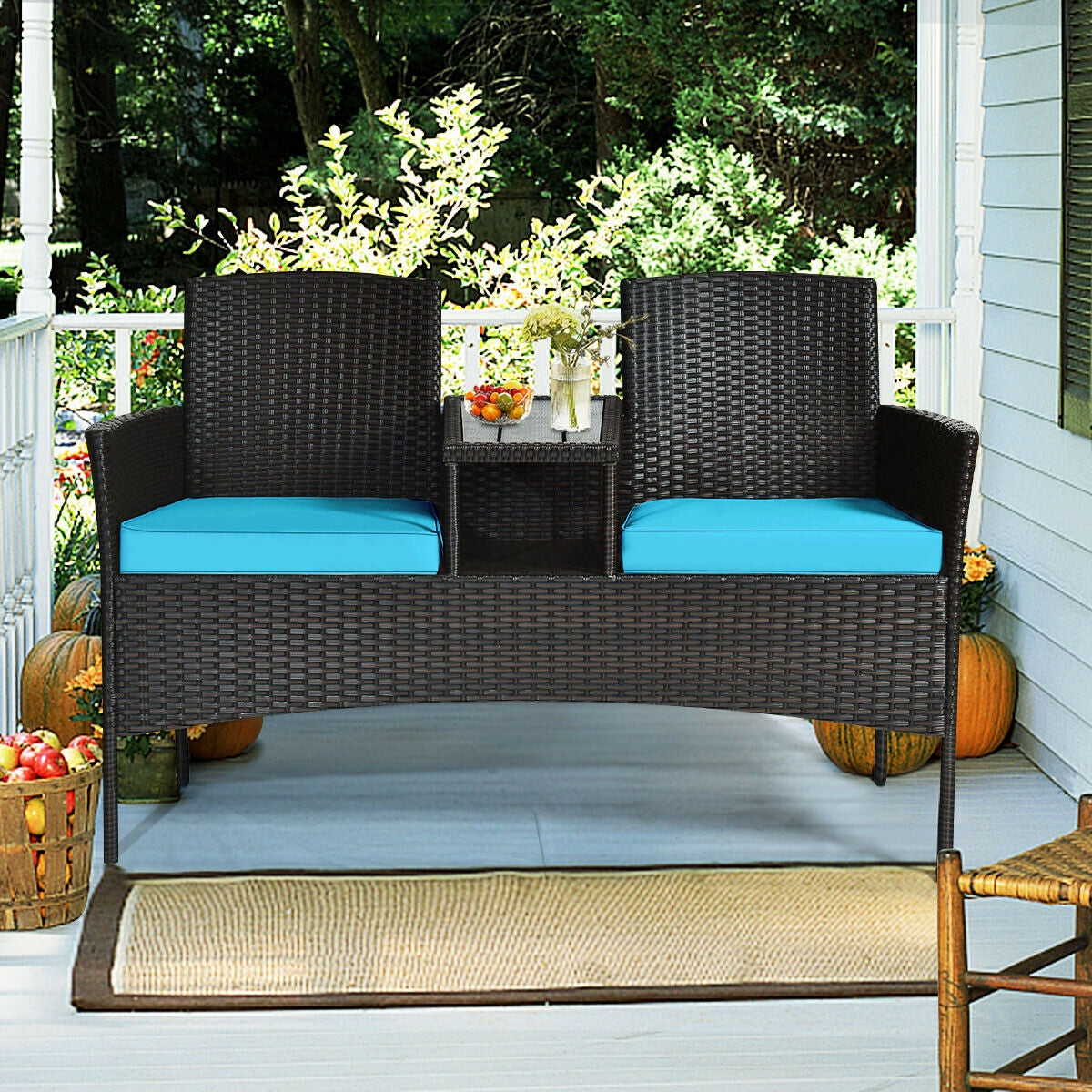 Modern 2-Piece Patio Conversation Set with Built-In Coffee Table & Cushions in Turquoise, placed on a porch with decorative plants and fruits, illustrating outdoor comfort.