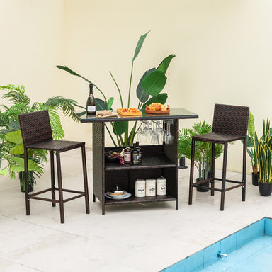 3-Piece Outdoor Wicker Bar Set with 3-Row Stemware Racks, featuring stylish seating and a chic bar table with a layered design, set against a tropical backdrop, perfect for outdoor entertaining.