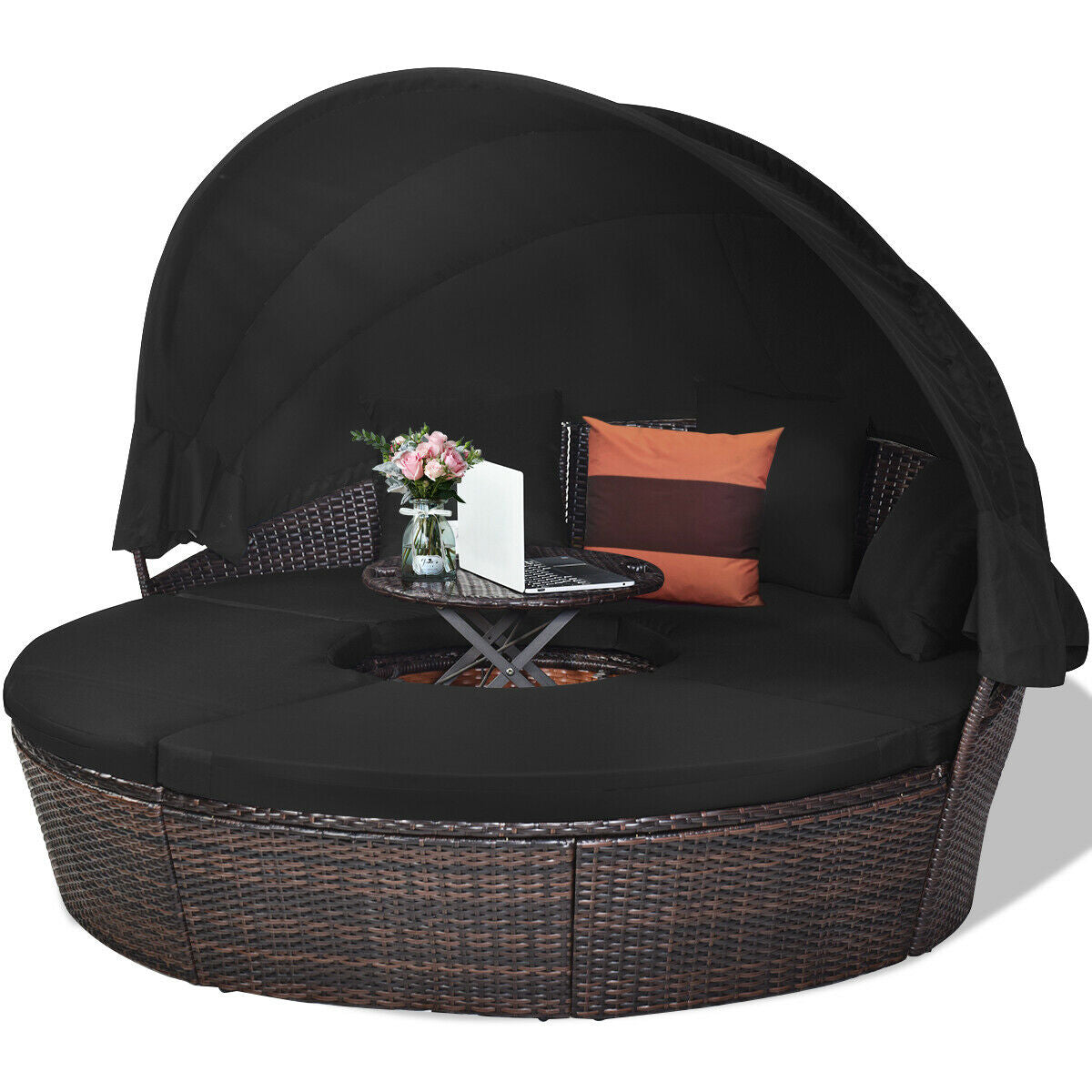Elegant Black Rattan Round Daybed complete with a Retractable Canopy, cozy cushions, and a table for refreshments in an outdoor setting.