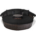 Cozy Black Rattan Round Daybed with plush cushions and a small table, ideal for enjoying sunny days outdoors.