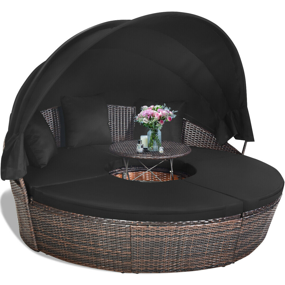 Stylish Black Rattan Round Daybed with adjustable canopy and table, set in a tropical outdoor setting.
