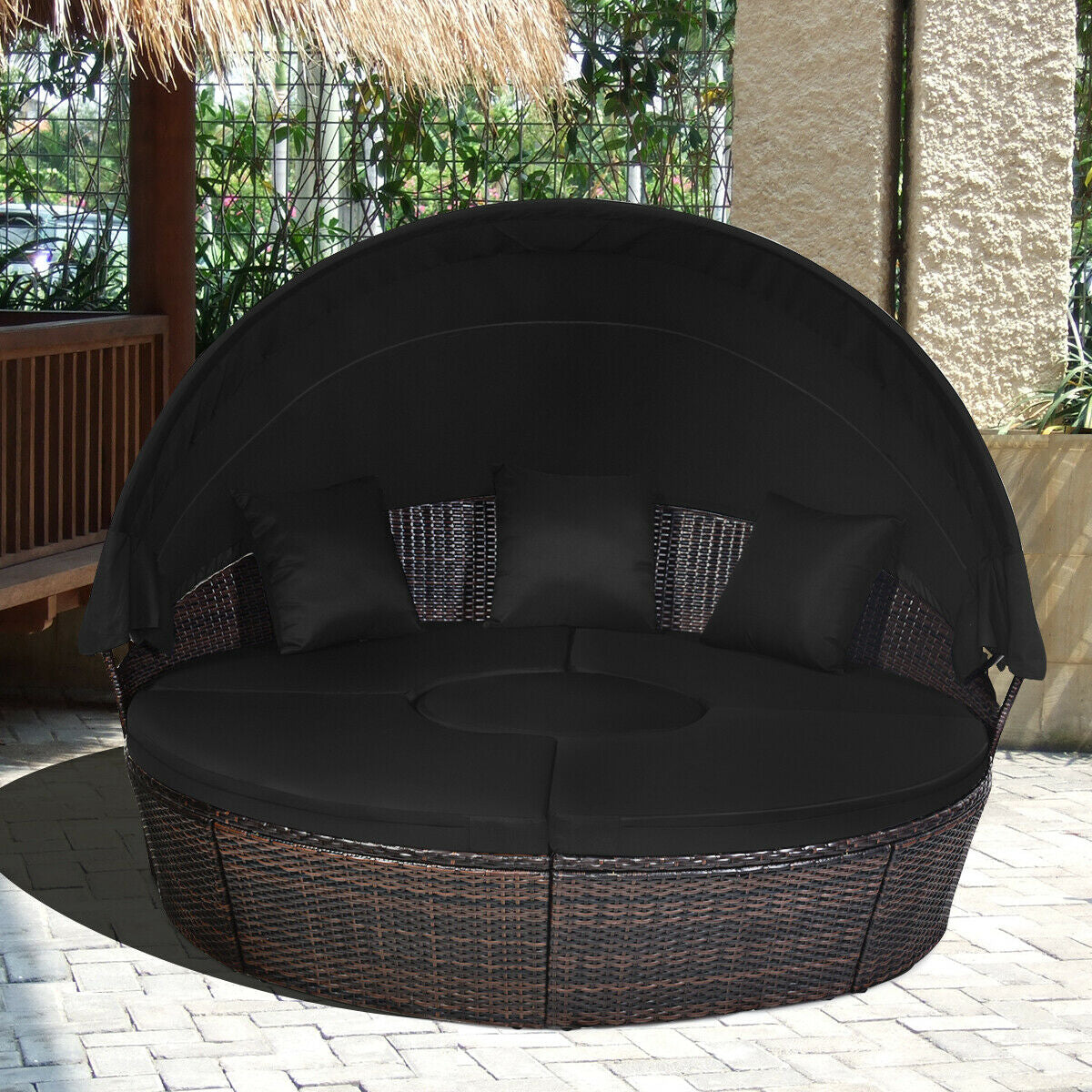 Black Rattan Round Daybed featuring a retractable canopy and an adjustable table, perfect for outdoor relaxation.