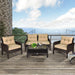 4-Piece Outdoor Rattan Furniture Set with Cushions, Loveseat, 2 Single Sofas & Coffee Table arranged on a stylish deck overlooking a beautiful view of the sea.