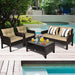 4-Piece Outdoor Rattan Furniture Set with Cushions, Loveseat, 2 Single Sofas & Coffee Table set near a pool with vibrant flowers, perfect for outdoor relaxation.
