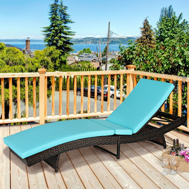 Folding Adjustable Rattan Chaise Lounge Chair with Thick Cushion - Turquoise, 5-Level Recline, 400 lbs Capacity on a balcony with a scenic view.