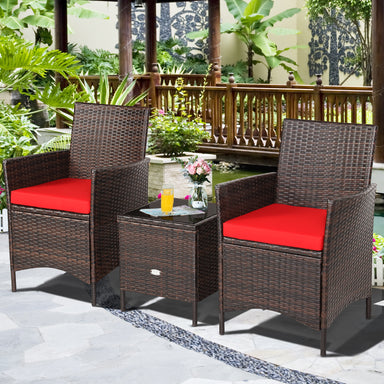 3-Piece Red Cushioned Patio Rattan Furniture Set with Glass Tabletop for Outdoor Living, showcasing two stylish rattan chairs with vibrant red cushions and a matching glass table, surrounded by lush greenery.