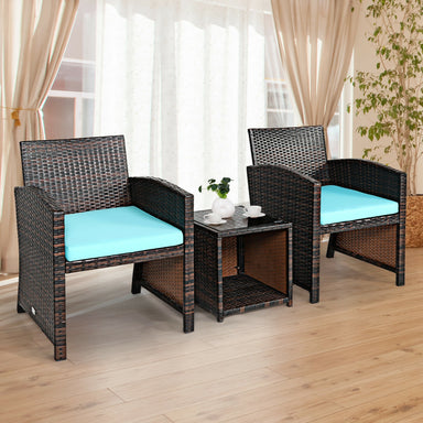 Indoor view of the 3-Piece Outdoor PE Rattan Wicker Furniture Set with Turquoise Cushions & Coffee Table by Dream Yard Oasis, displayed in a cozy room with natural light.