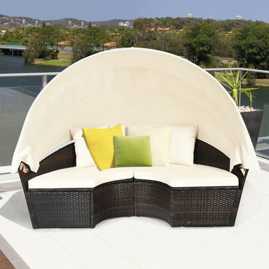 Spacious 5-Piece Patio Round Daybed Set with Canopy, Cushions & Adjustable Coffee Table from Dream Yard Oasis ™, displayed on a balcony with comfy cushions and a protective canopy.
