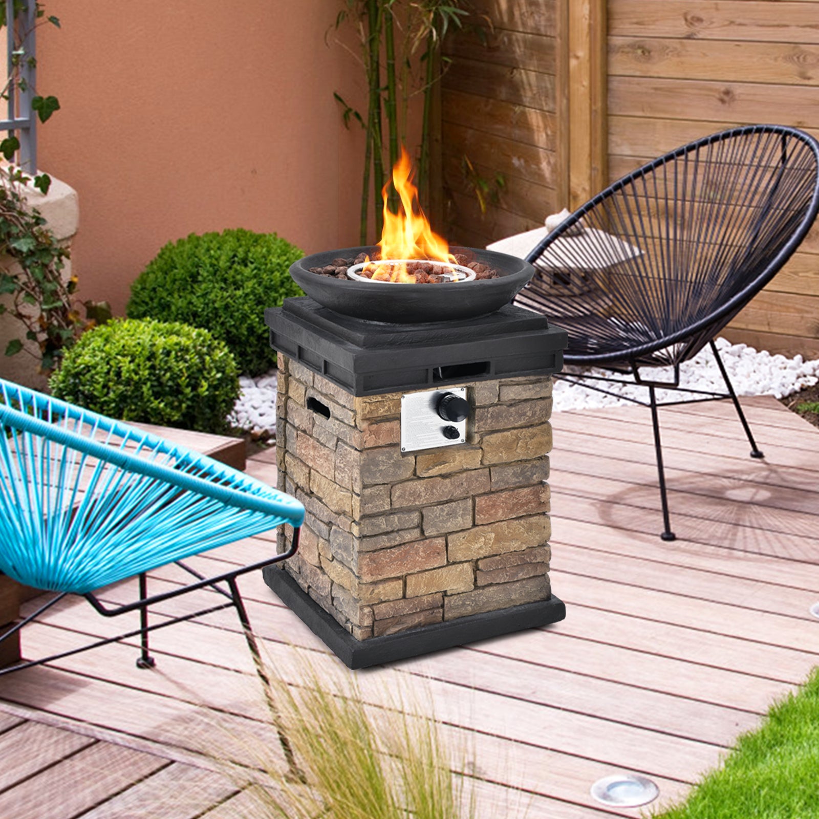 Elevate your patio with the 40,000 BTU Outdoor Propane Fire Bowl Column. Stylish fire bowl on a wooden deck, showcasing its brown stacked stone design.
