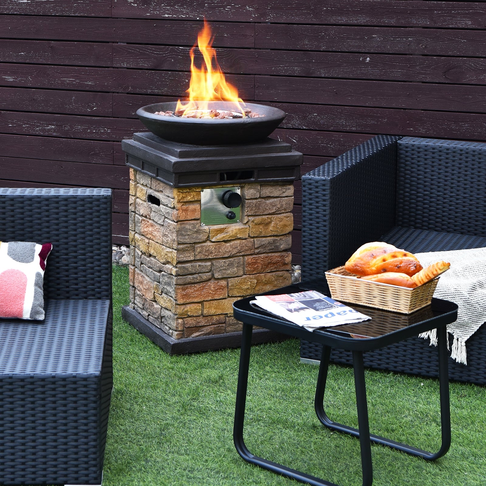 Transform your backyard with the 40,000 BTU Outdoor Propane Fire Bowl Column. Modern fire pit creating ambiance beside comfortable seating.