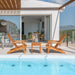 3-Piece Eucalyptus Adirondack Chair Set with Widened Armrests and Convenient Side Table, arranged beside a pool with a modern backdrop, ideal for outdoor relaxation.