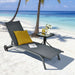 Enjoy the sun by the beach on the 6-Position Adjustable Outdoor Chaise Lounge Chair with Wheels, showcased with a yellow pillow and drinks, perfect for relaxation.