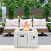 Elegant 34" Square Concrete Propane Fire Pit Table in a stylish patio setting, designed for a relaxing outdoor experience.